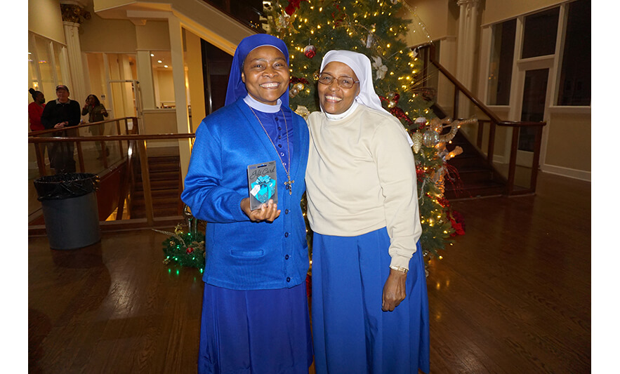 NCC Employee Holiday Party 12-14-2023 Sister Pauline and Sister Elizabeth with gift card for web