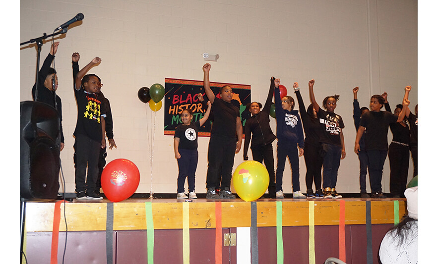 Youth Services Black History Month 3-1-2024 End of dance arms up for web